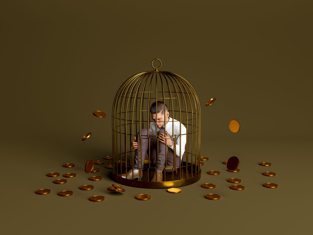 From Paycheck to Power: The Investment Guide to Financial Freedom 1 Investment guide – person trapped in a golden cage surrounded by coins symbolizing the illusion of financial safety